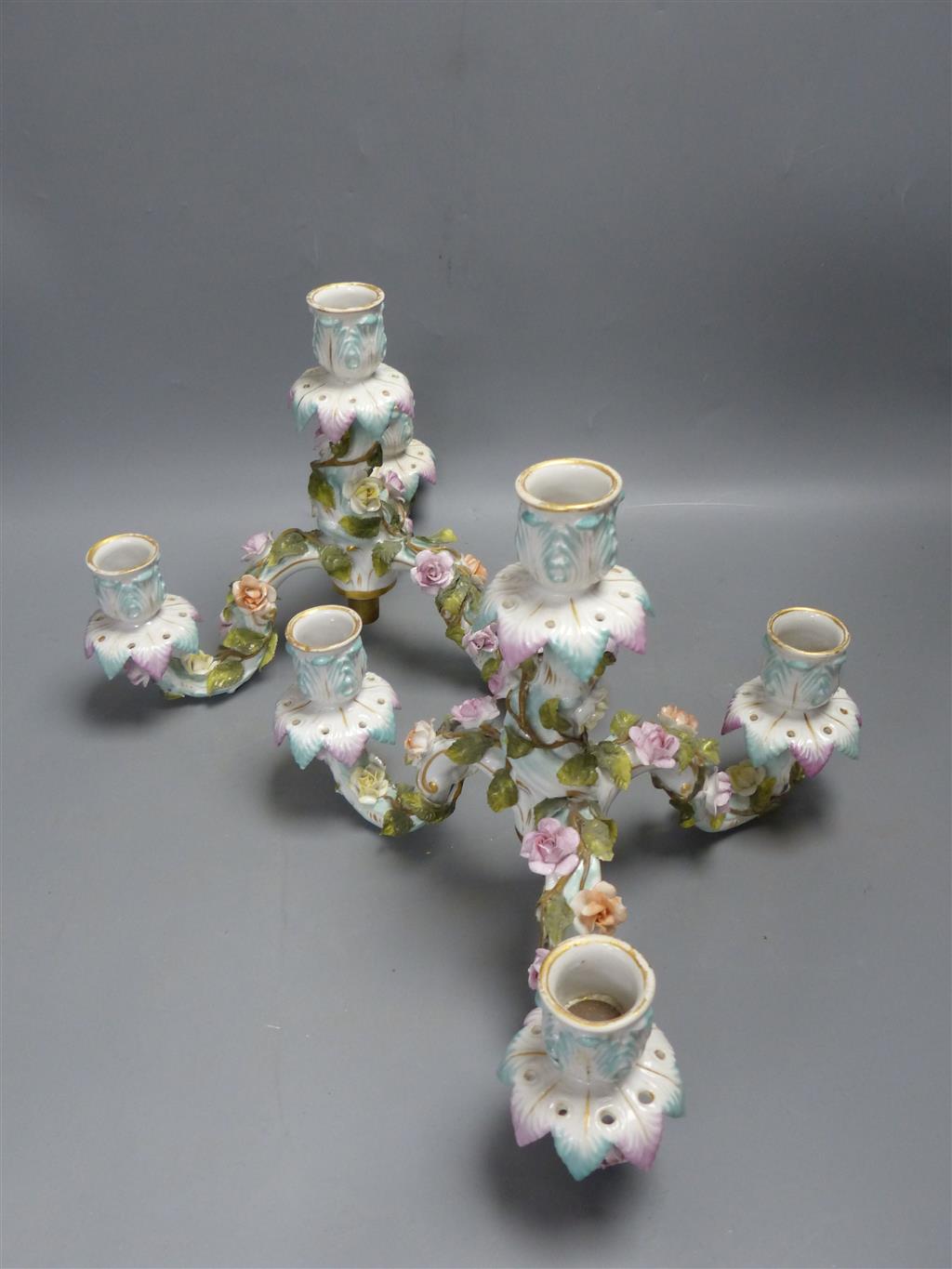 A pair of early 20th century Plaue porcelain figural candelabra, overall height 48cm